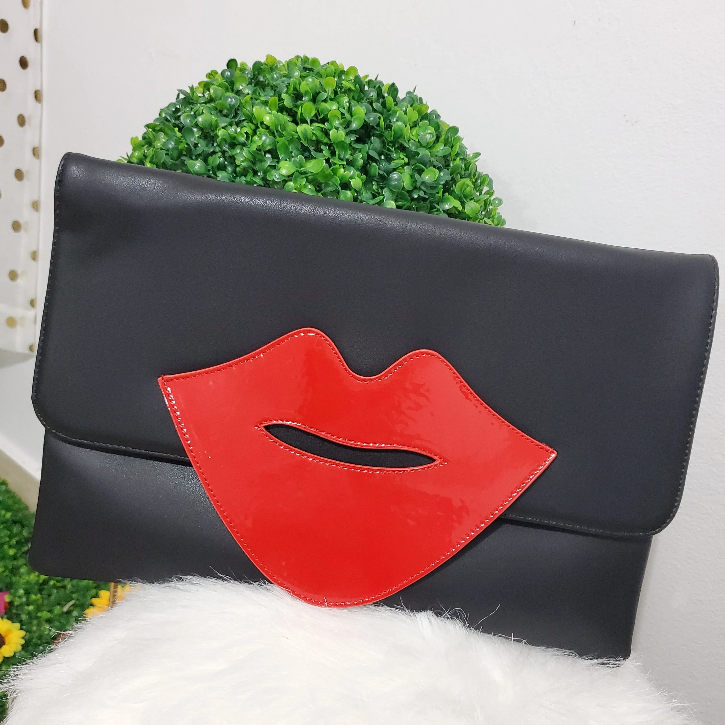 Red Lips Black Clutch